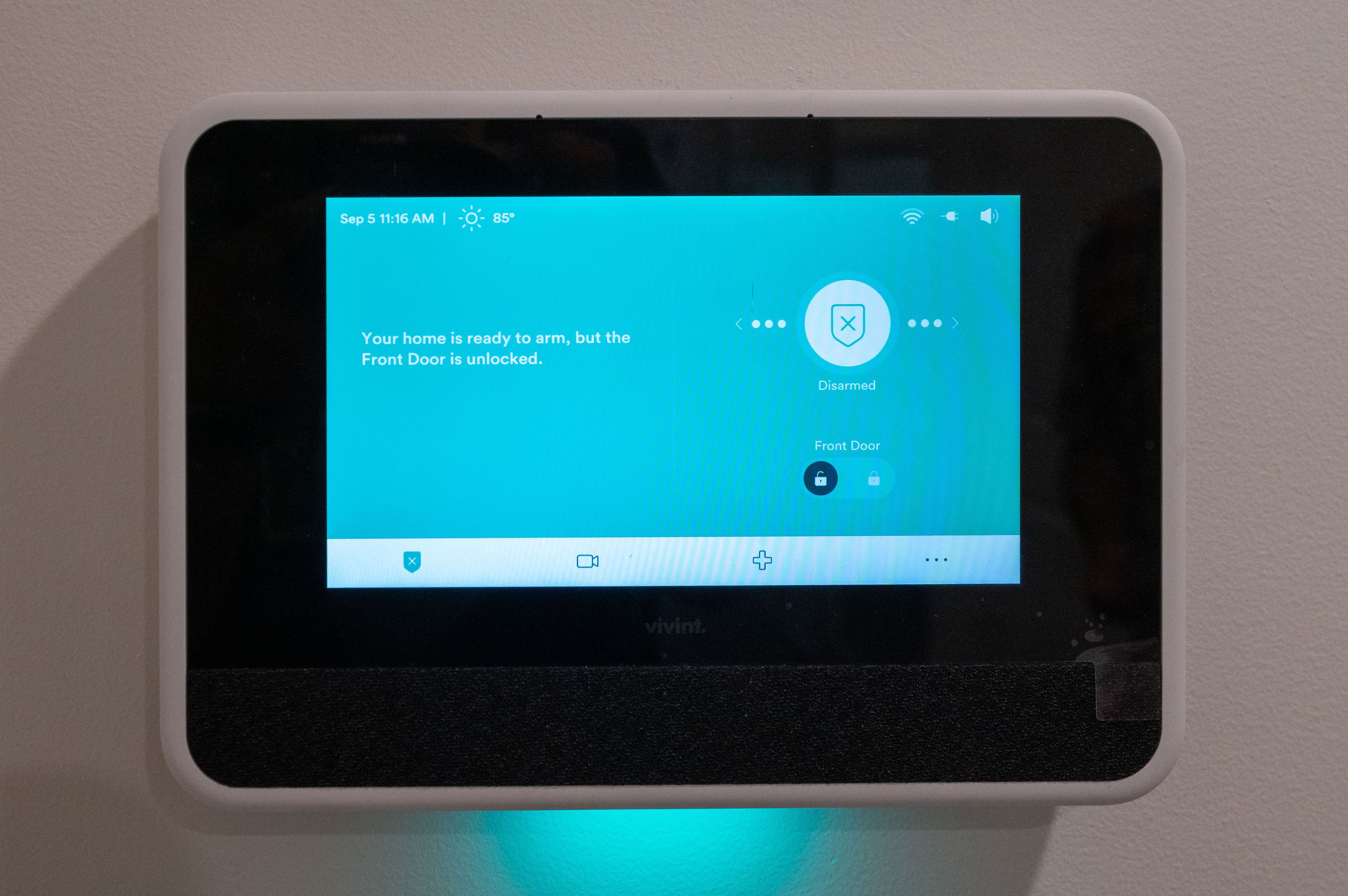 A smart home device displaying a message about the front door status.