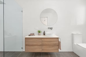 Bathtub, hair dryer, towels, soap - The Cove - Stunning, Ocean View Beach House! (Black Head)