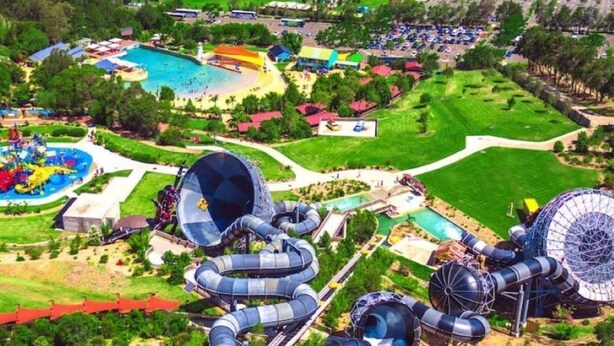 An aerial view of a theme park with water slides, a large pool, and various buildings. - Kiama Home By the Sea, Beach and Mountain Views - Newly Renovated (Kiama)