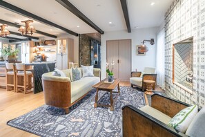 A modern living room with a sofa, chairs, a coffee table, and a patterned rug. - Incredible 8 Bedroom Aerie Estate - Minutes to Main Street - Unobstructed Views of Park City (Park City)