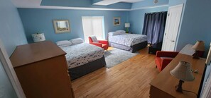 A bedroom with two beds, a desk, a chair, a lamp, and a window with blinds. - Ponte Vedra Wilderness Oasis minutes from TPC and the beach (Ponte Vedra Beach)