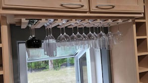 A kitchen with wooden cabinets and a window. - Ponte Vedra Wilderness Oasis minutes from TPC and the beach (Ponte Vedra Beach)