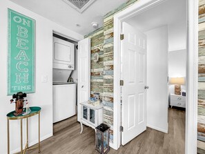 Enjoy cooking in this well-equipped kitchen with a refrigerator, oven, and ample storage.