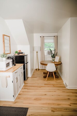 Fridge, microwave, coffee/tea maker, cookware/dishes/utensils