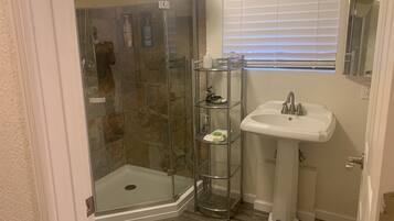 Combined shower/bathtub, soap, toilet paper