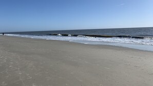 A beach with a clear sky and calm sea. - Hilton Head First Floor Ocean View with Balcony, Pool, and Tennis (Hilton Head Island)