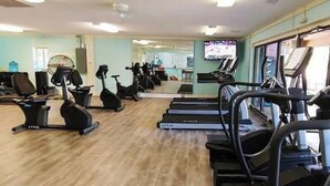 A gym with treadmills, stationary bikes, and elliptical machines. - Hilton Head First Floor Ocean View with Balcony, Pool, and Tennis (Hilton Head Island)