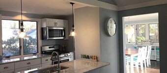 Renovated Home with heated pool near the beach! Fenced in yard +pet friendly