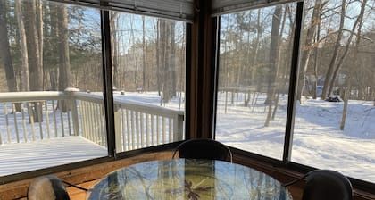 Up-north wood cabin, steps from river, 1 mile to Crystal Mtn Resort, free wifi.