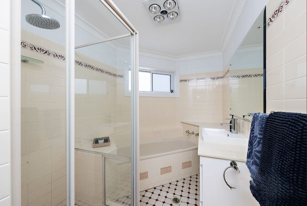Bathtub, towels, soap, toilet paper