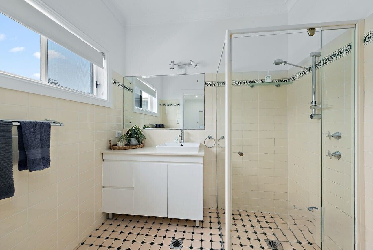 Bathtub, towels, soap, toilet paper