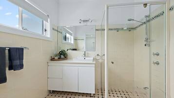 Bathtub, towels, soap, toilet paper