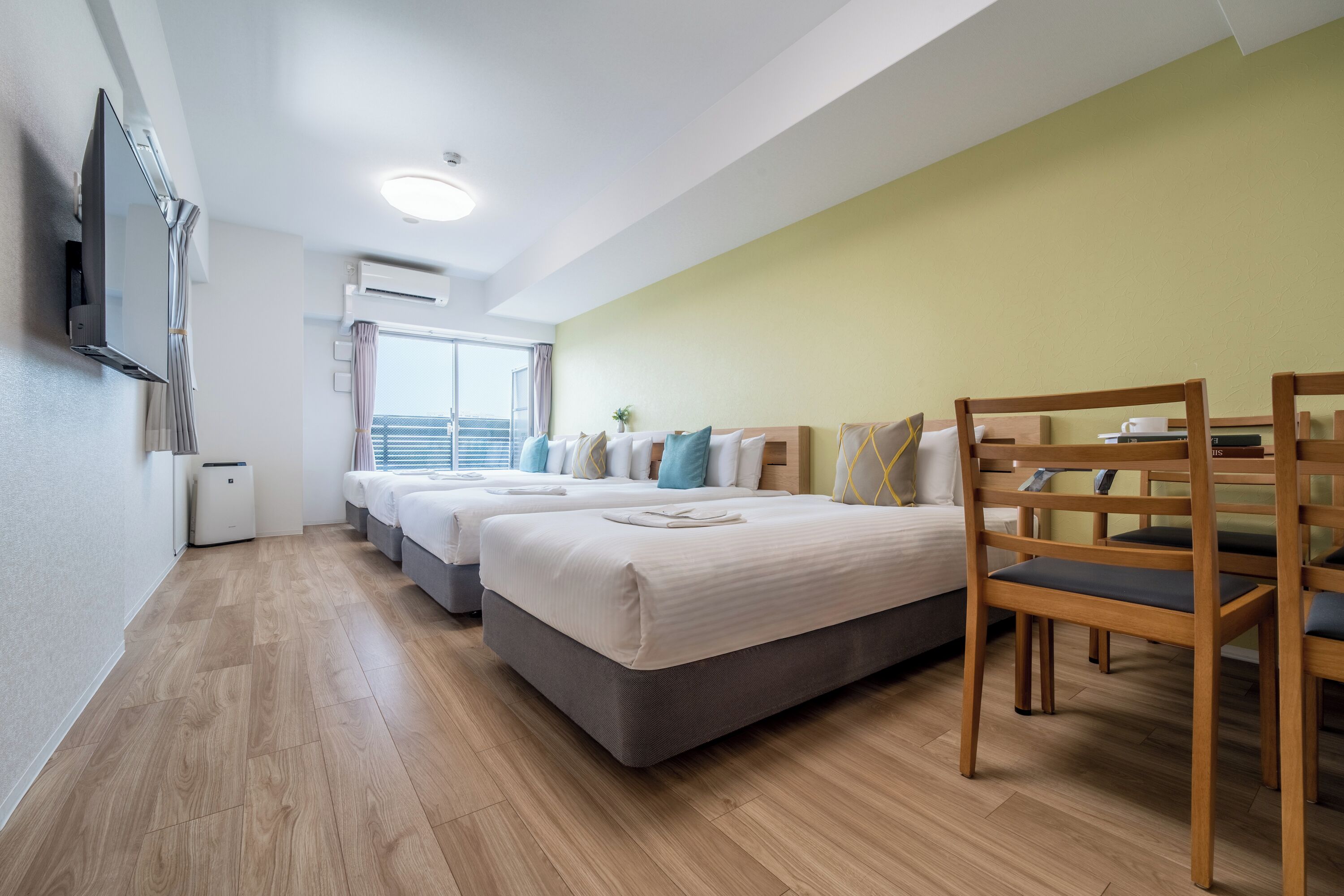 Deluxe Quadruple Room, Multiple Beds, Non Smoking, City View | Premium bedding, blackout drapes, iron/ironing board (on request)