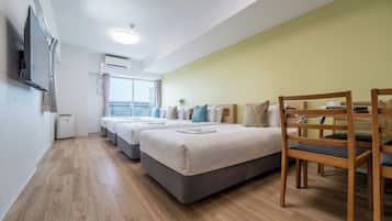 Deluxe Quadruple Room, Multiple Beds, Non Smoking, City View | Premium bedding, blackout drapes, iron/ironing board (on request)