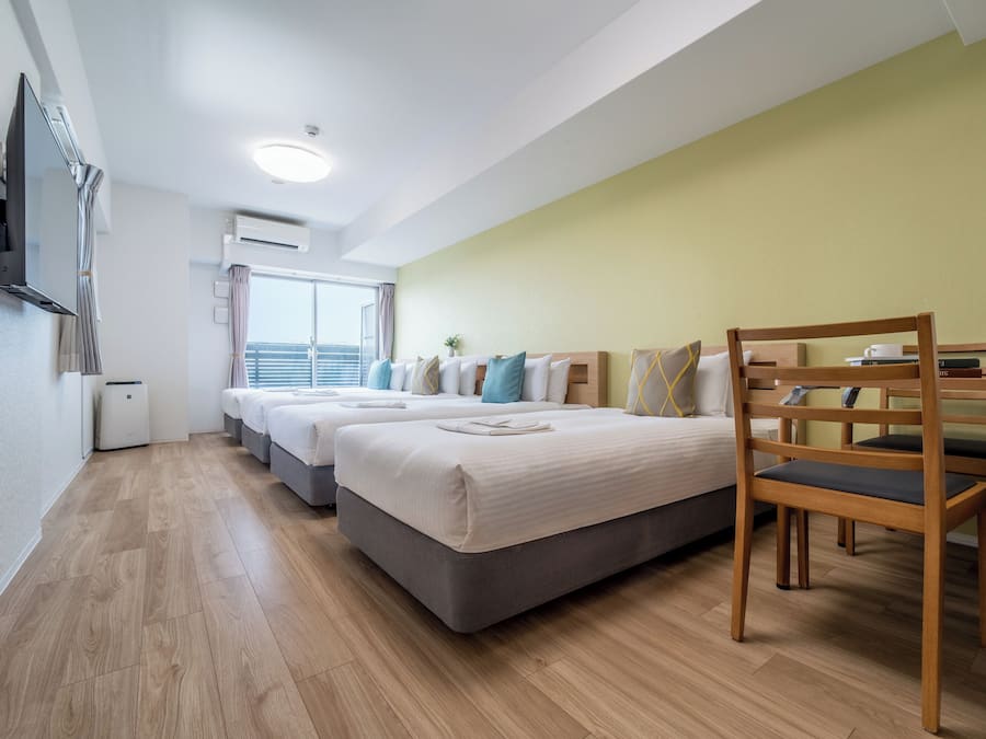 Deluxe Quadruple Room, Multiple Beds, Non Smoking, City View | Premium bedding, blackout drapes, iron/ironing board (on request)