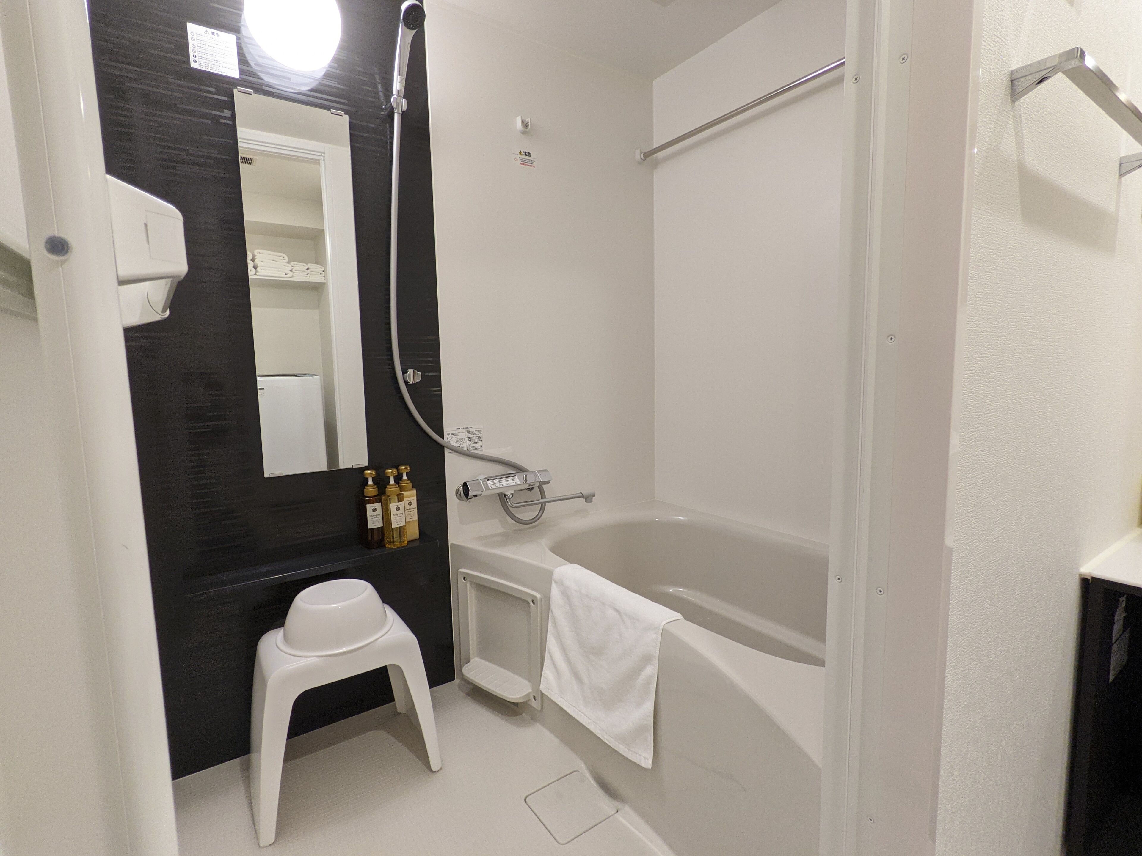 Separate bathtub and shower, free toiletries, hair dryer, slippers