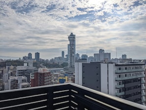 A cityscape with a prominent tower and various buildings.