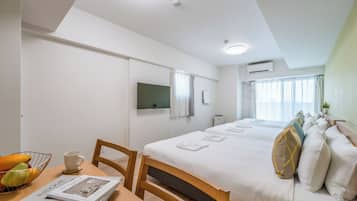 Deluxe Apartment, Multiple Beds, Non Smoking | Living area | 43-inch flat-screen TV with digital channels, TV