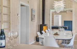 Enjoy meals in this inviting dining area with a round table and comfortable seating.