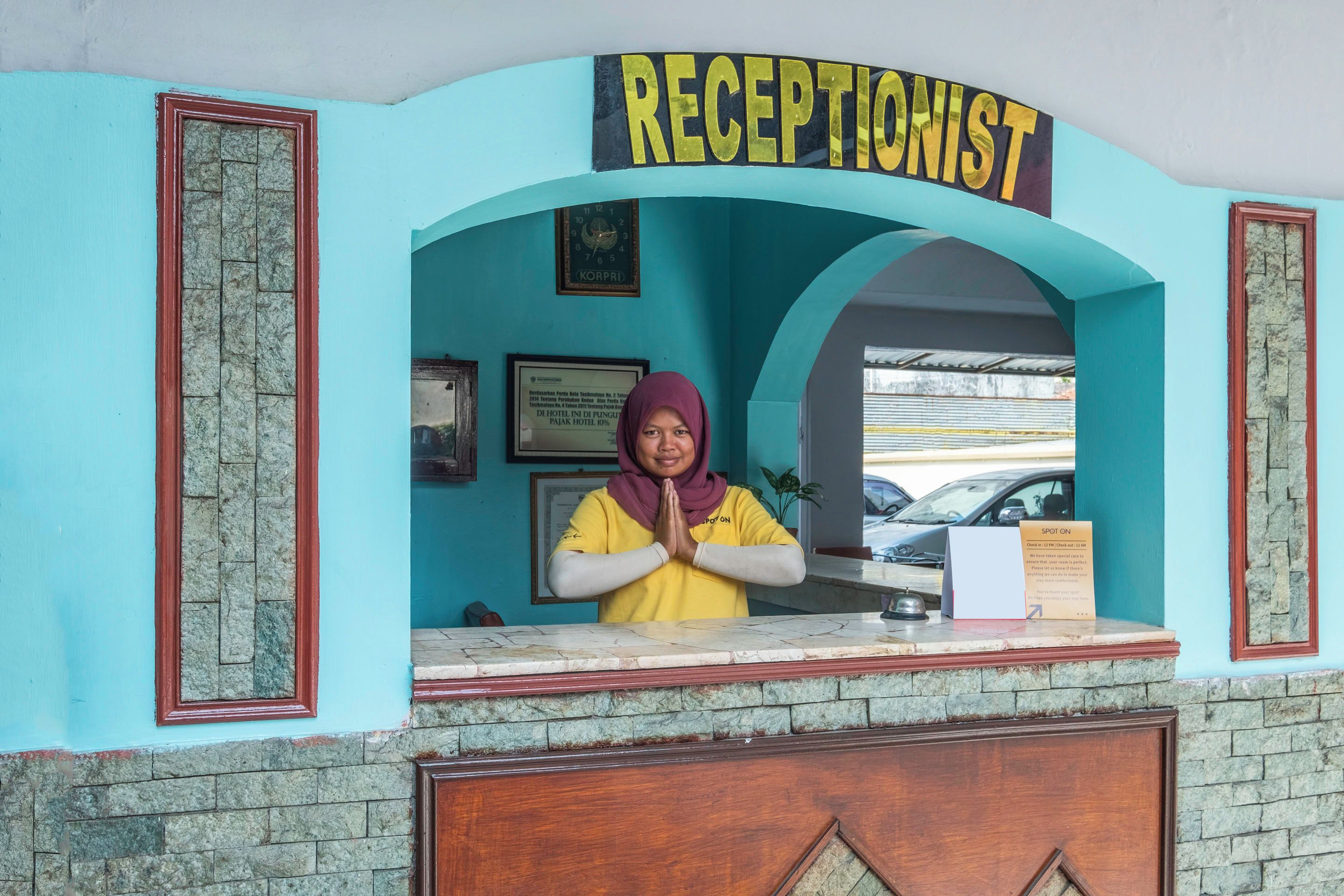 A reception desk with a sign reading 'RECEPTIONIST' above it.