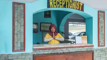 A reception desk with a sign reading 'RECEPTIONIST' above it.