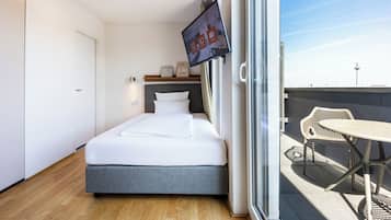 Hypo-allergenic bedding, desk, laptop workspace, blackout drapes