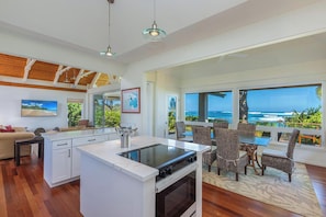 Enjoy ocean views from the dining area, where a stove and oven are central to the kitchen.