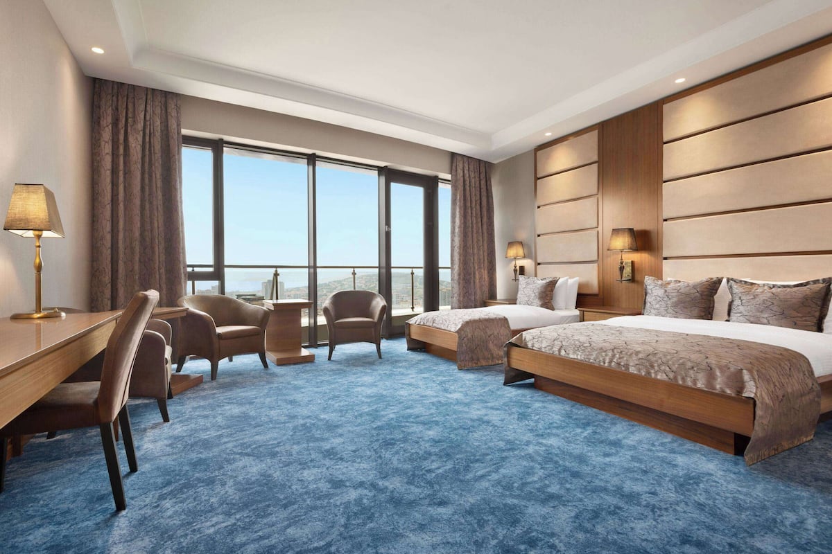Family Room, Multiple Beds, Non Smoking, Sea View | Minibar, in-room safe, desk, laptop workspace