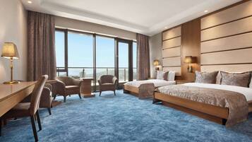 Family Room, Multiple Beds, Non Smoking, Sea View | Minibar, in-room safe, desk, laptop workspace