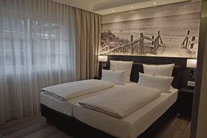 Habitación doble Deluxe | Ropa de cama de alta calidad, minibar y decoración personalizada 