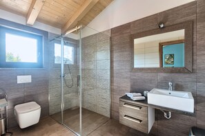 Bathtub, hair dryer, towels, soap