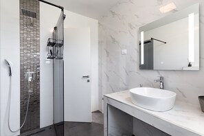 Shower, hair dryer, towels, soap