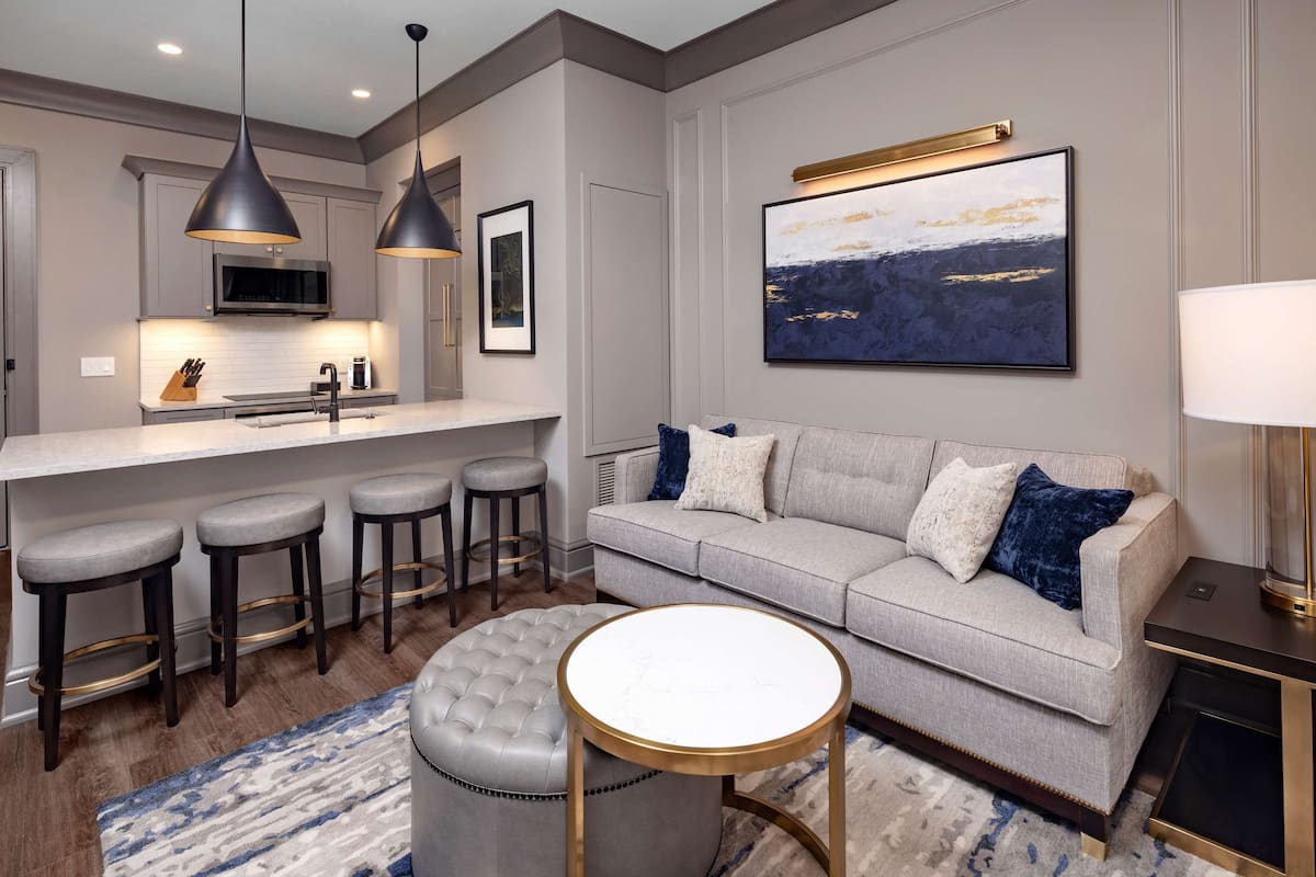 suite, 1 bedroom, balcony | living area | 65-inch flat-screen tv with cable channels, tv, streaming services