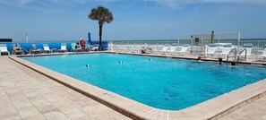 Outdoor pool, a heated pool - Dolphin View-oceanfront condo with large balcony overlooking no drive beach. (Ponce Inlet)