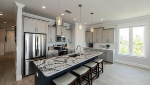 House, 5 Bedrooms | Private kitchen | Fridge, microwave, stovetop, dishwasher - Bayfront Retreat by AMI Locals (Bradenton Beach)