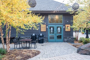 LELI WINE CHEESE PROVISIONS offers a charming outdoor seating area with a table and chairs.