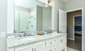 House, 5 Bedrooms | Bathroom | Hair dryer, towels - Castaway Cove by AMI Locals (Anna Maria)