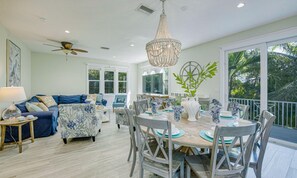 House, 6 Bedrooms | Living room | 42-inch flat-screen TV with cable channels, TV - Conch House by AMI Locals (Holmes Beach)