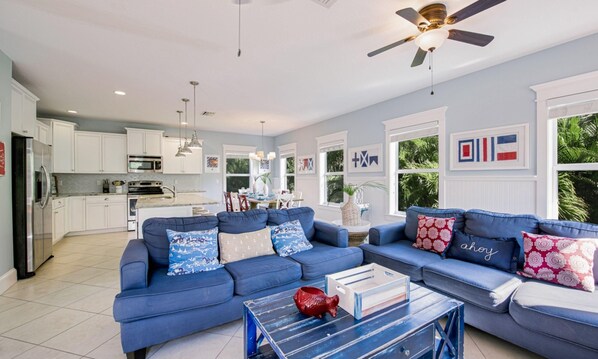 House, 6 Bedrooms | Living room | 42-inch flat-screen TV with cable channels, TV - Coastal Cove by AMI Locals (Bradenton Beach)