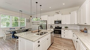 House, 4 Bedrooms | Private kitchen | Fridge, microwave, stovetop, cookware/dishes/utensils - Island Pearl Oasis by AMI Locals (Holmes Beach)