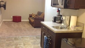 A compact kitchen with a refrigerator, microwave, and sink. - Cove On A Hill - Entire (2Bdrm & Full Bath) Basement Suite (Calgary)