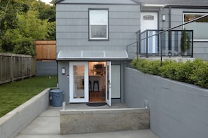 Stylish entrance with a garden and balcony.