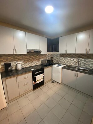 Private kitchen - 2 Bedroom Apart in the Heart of Vision City Kigali (Kigali)
