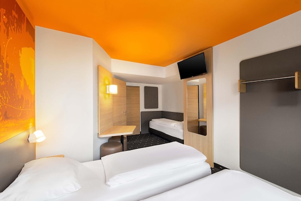 Quartos à prova de som, Wi-Fi de cortesia, roupa de cama