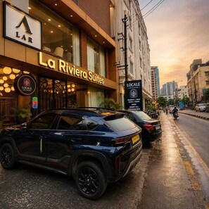 A hotel named 'La Riviera Suites' with a sign for 'LAR' and 'LOCALE' nearby. - Room-la Riviera Suites Premium Stay in (Hyderabad)