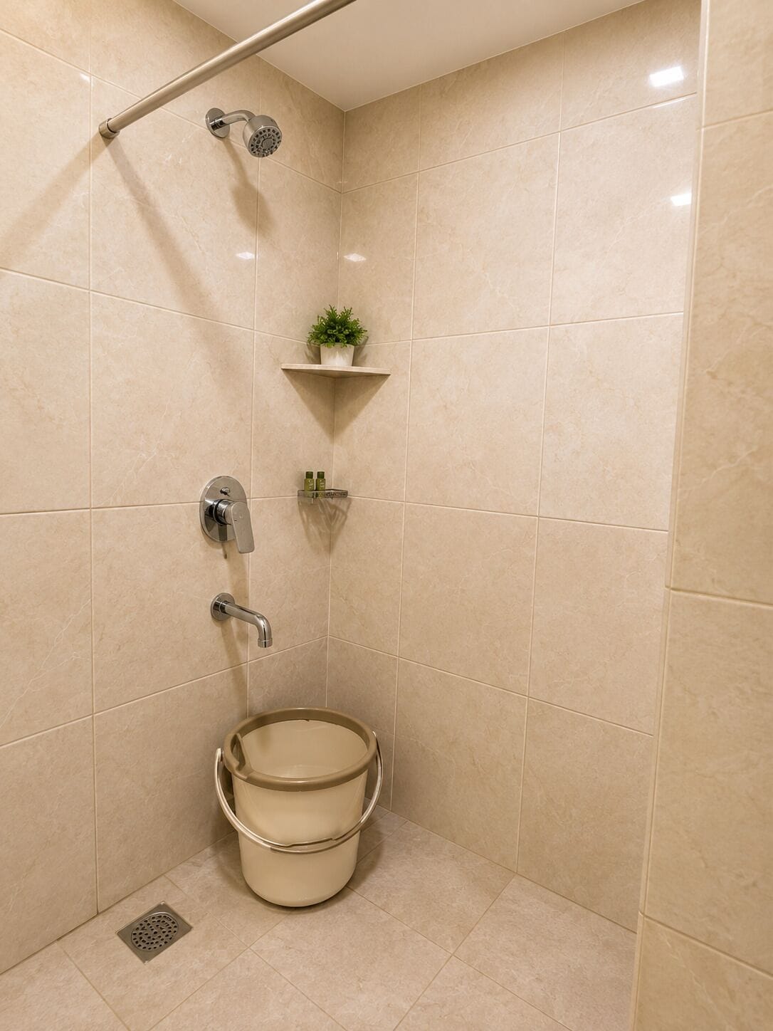A bathroom with a shower, a toilet, and a sink.