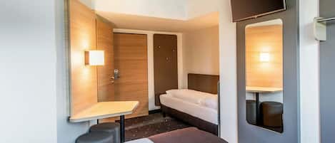 Escriptori, habitacions insonoritzades, wifi gratuïta i roba de llit