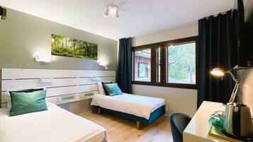 Laptop workspace, blackout curtains, free WiFi, bed sheets