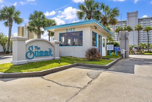 A hotel entrance with a sign reading "The Summit" and the number 8743. - The Summit 1222 (Panama City Beach)