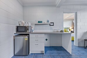 Fridge, microwave, toaster, cookware/dishes/utensils